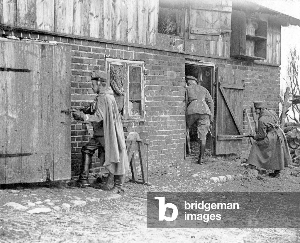 German Hussars ransack a farmhouse, 1915 (b/w photo)