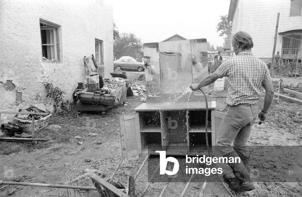 Cleaning up after a storm at Lake Chiemsee, 1974 (b/w photo)