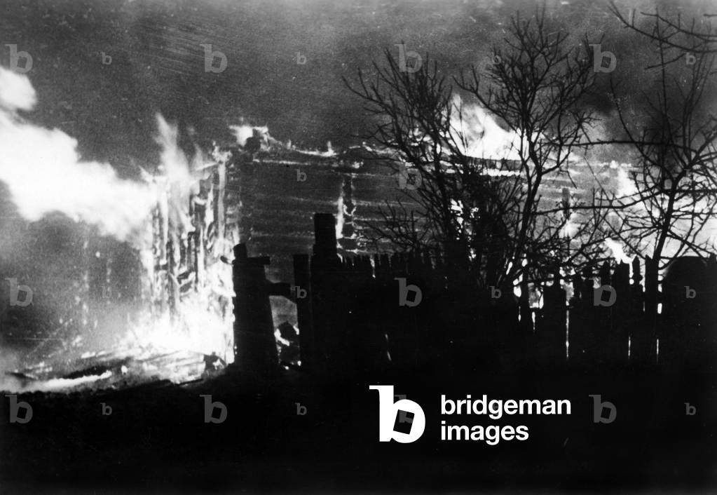 Burning houses in Kholm, 1942 (b/w photo)