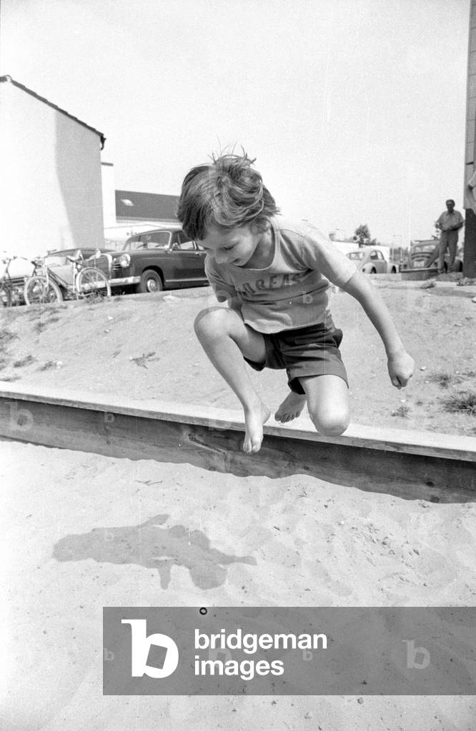 Child playing,1974 (b/w photo)