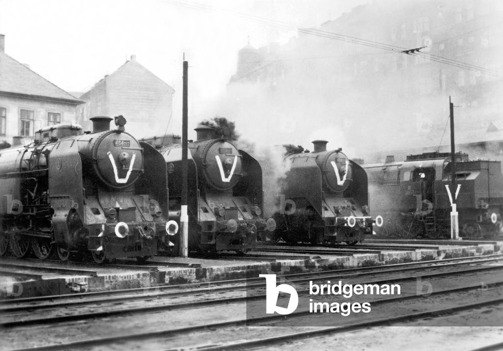 Locomotives decorated with a 'V' in the train station in Prague (b/w photo)