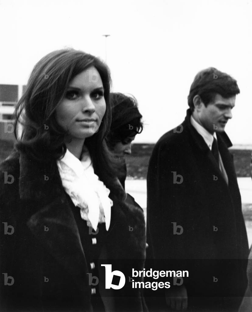 Women and a man (b/w photo)