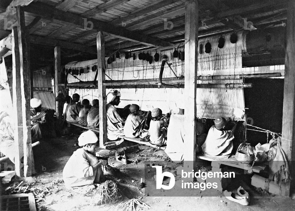 Carpet weavers in Kashmir (b/w photo)