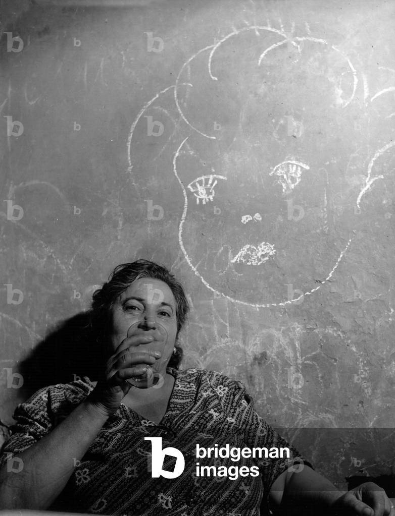 Elderly woman in Rome (b/w photo)