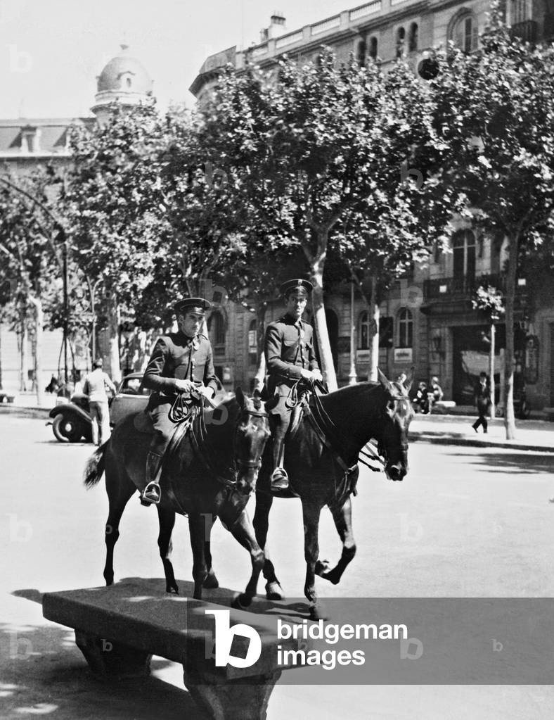 Mounted police officers in Barcelona, 1936 (b/w photo)
