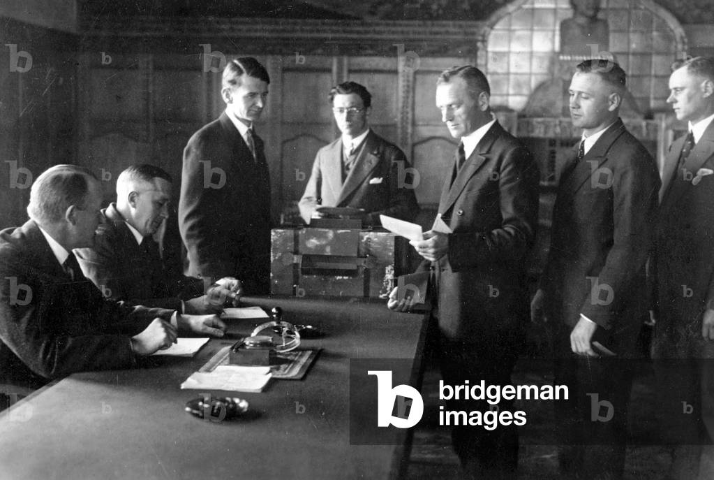 The crew of the Zeppelin casting their votes for the Reich presidential election, 1932 (b/w photo)