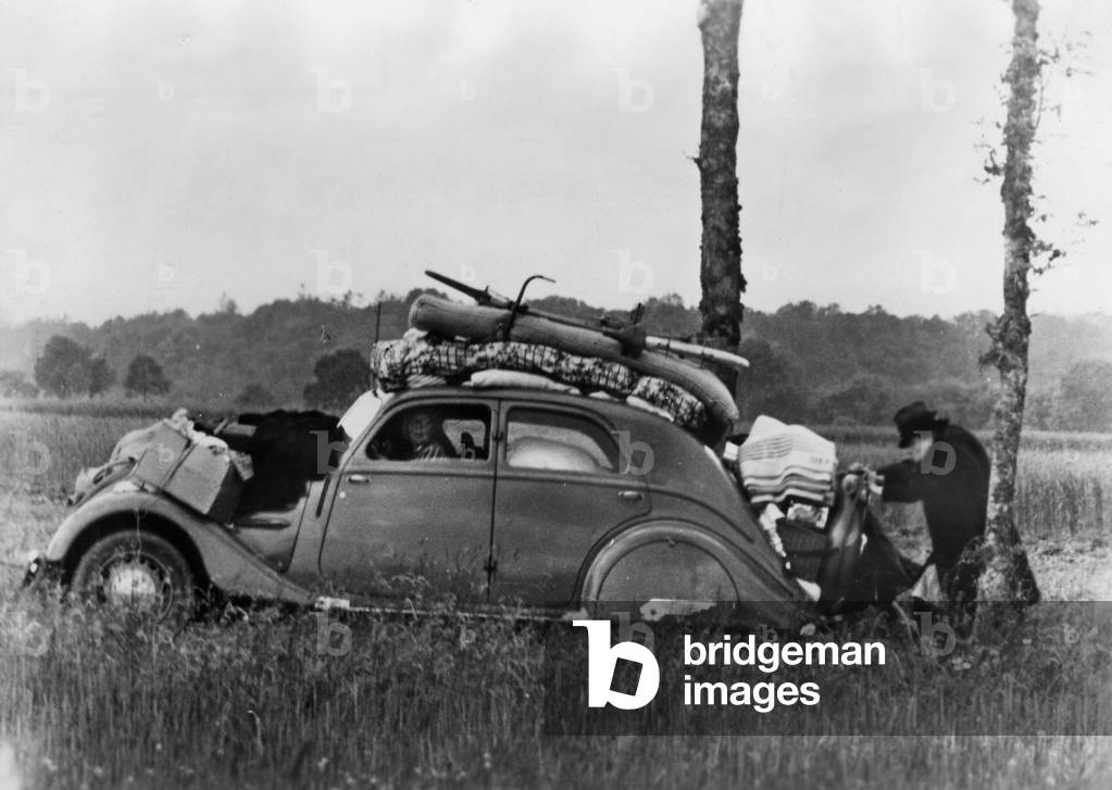 French civilians fleeing, 1944 (b/w photo)
