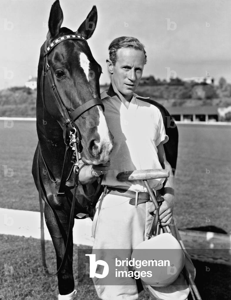 Leslie Howard playing polo, 1936 (b/w photo)