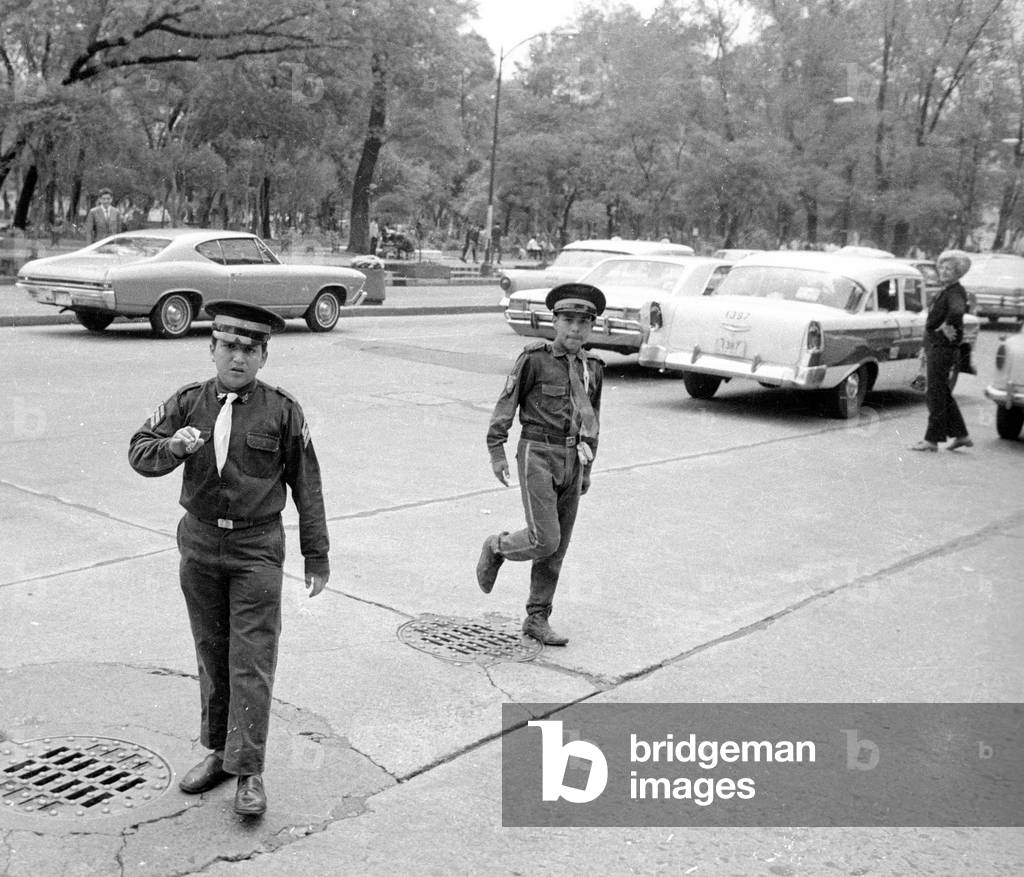 Children as auxiliary policemen directing traffic in Mexico City, 1970 (b/w photo)