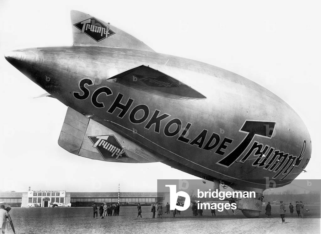 A blimp with a chocolate ad, 1930 (b/w photo)