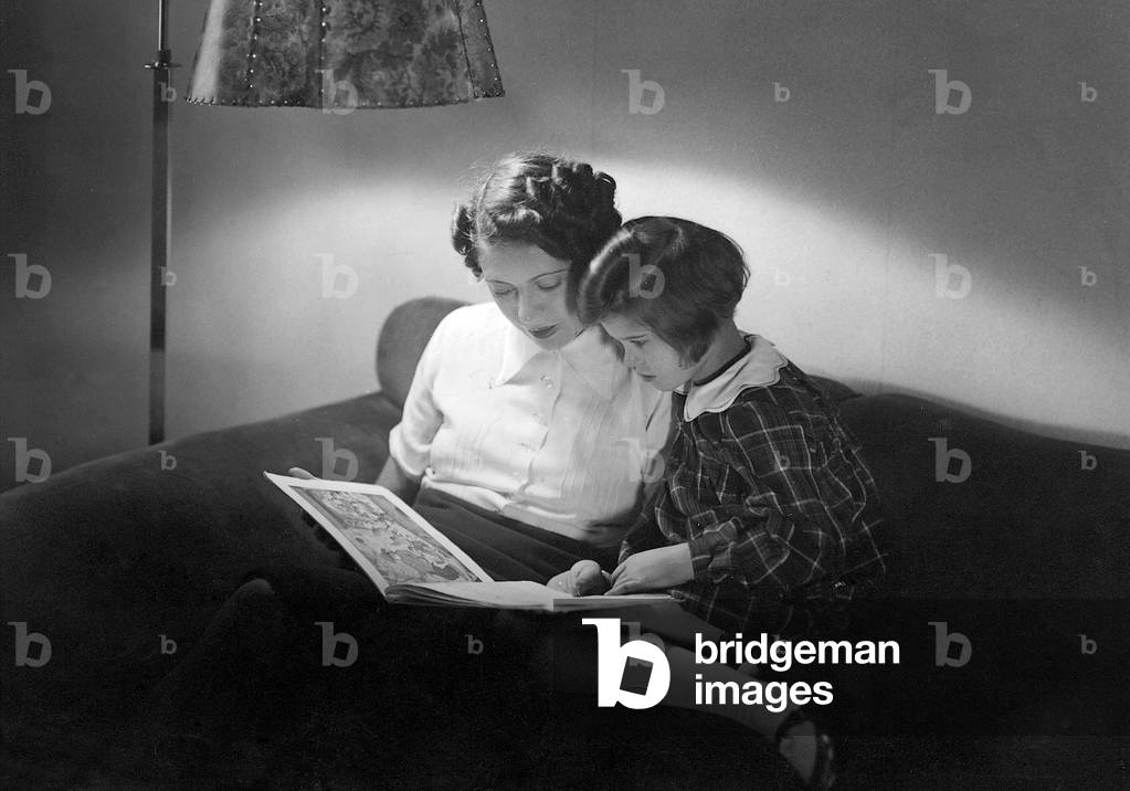 Reading aloud, 1937 (b/w photo)