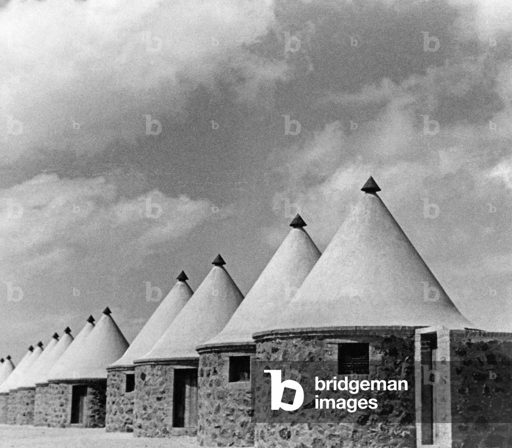Huts for workers at the Suez Canal, 1939 (b/w photo)