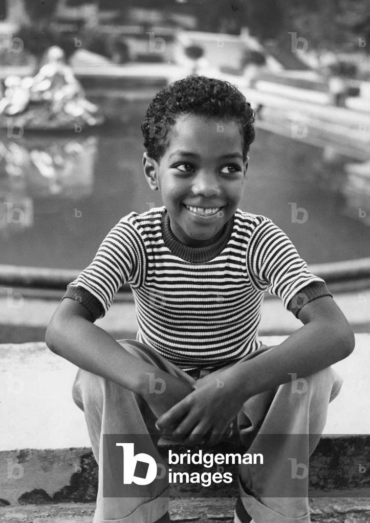 A black boy in Germany, 1950's (b/w photo)