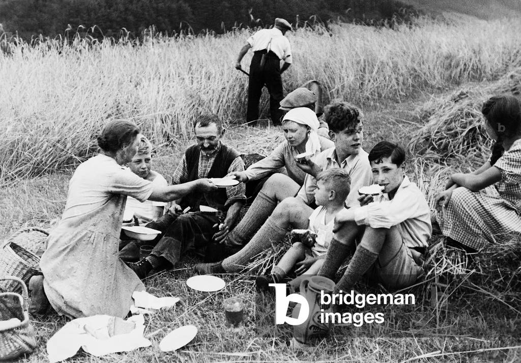 Farming family eats, 1936 (b/w photo)