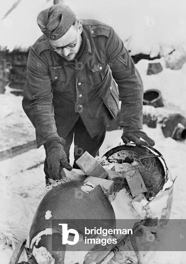 German soldier on a bomb supply, 1942 (b/w photo)