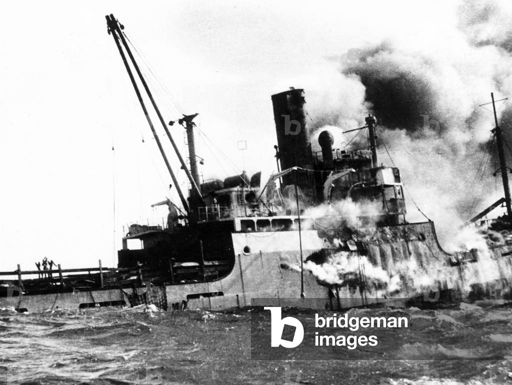 Sinking of the 'Houston' after bombardment by Castro's airforce, Bay of Pigs Invasion, Cuba, 1961 (b/w photo)