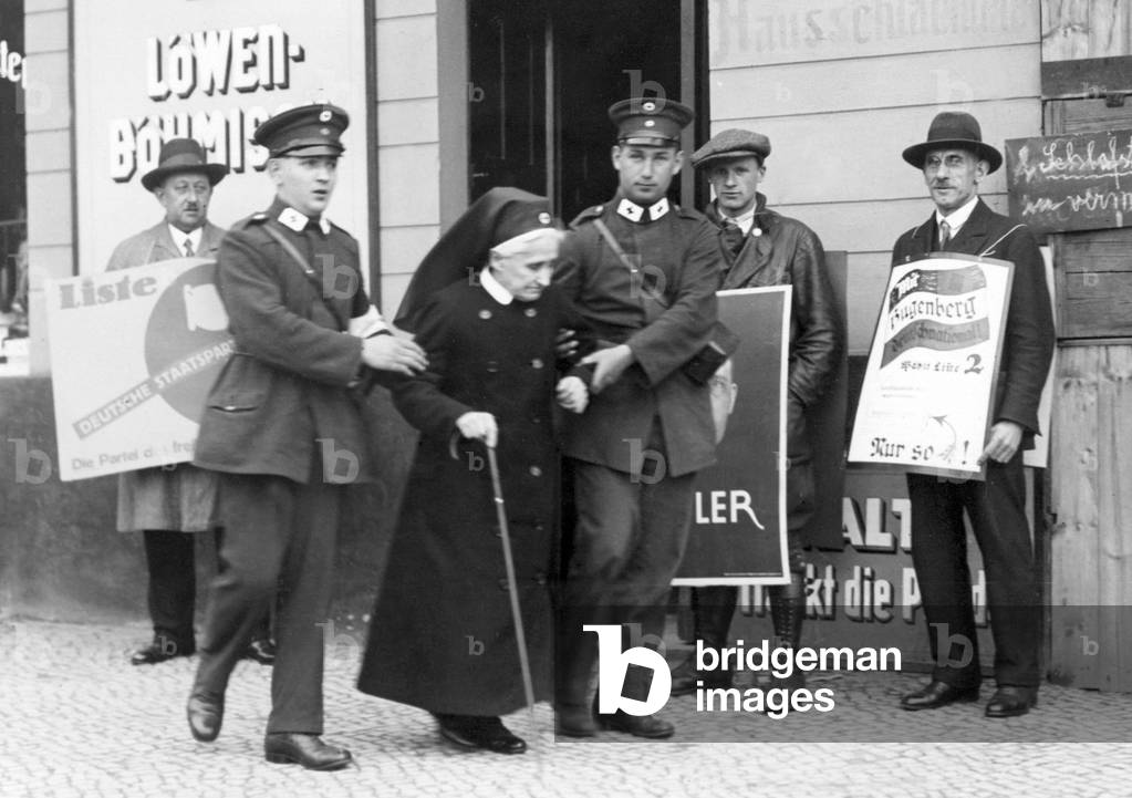 Paramedics help an old woman to exercise her voting rights, 1930