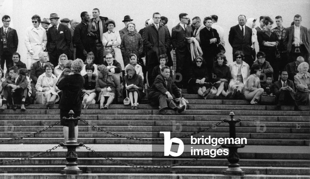 People on steps in London, 1967 (b/w photo)