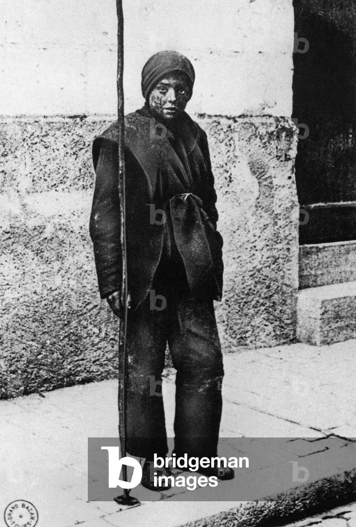 Chimney sweeper in Paris, 1870 (b/w photo)