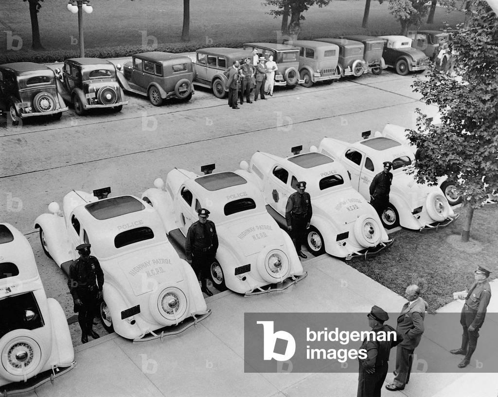 Policemen with their new patrol cars on Long Island, 1935 (b/w photo)