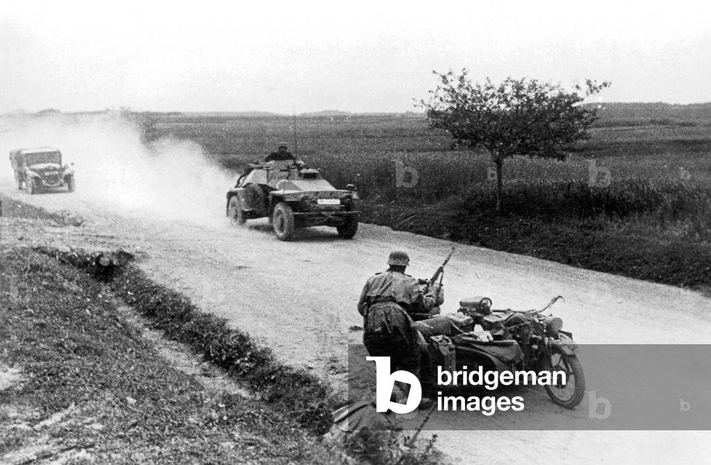 German armored reconnaissance vehicle and motorcyclist on the Eastern Front, 1941 (b/w photo)
