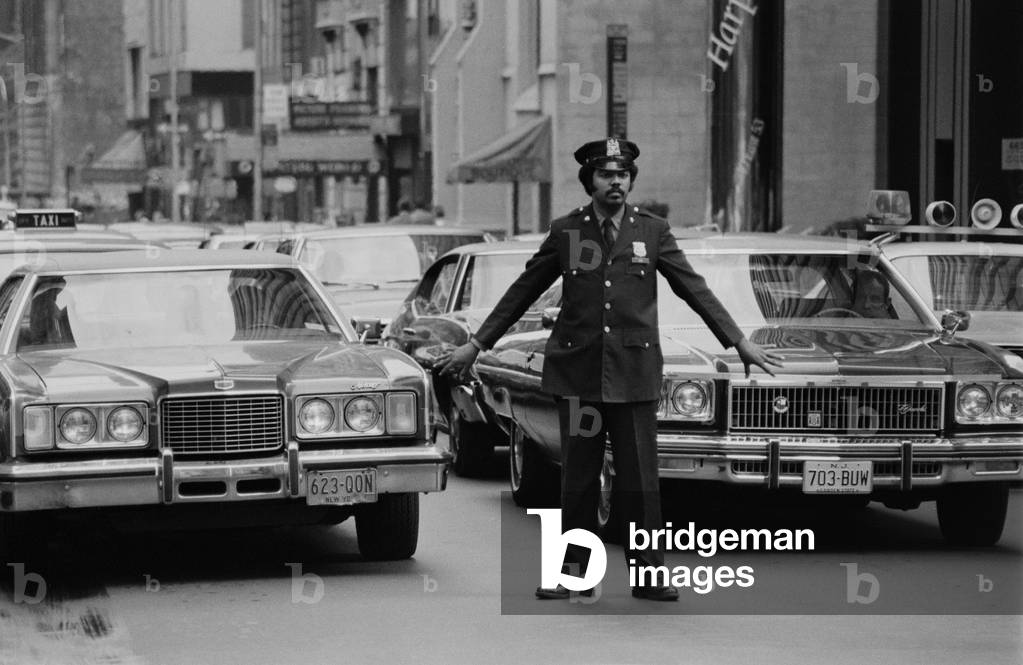 Policeman directing traffic in New York (b/w photo)