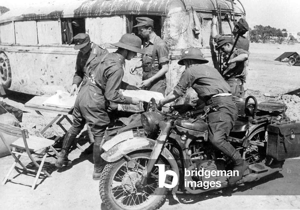 Motorcyclists at the front in Africa (b/w photo)