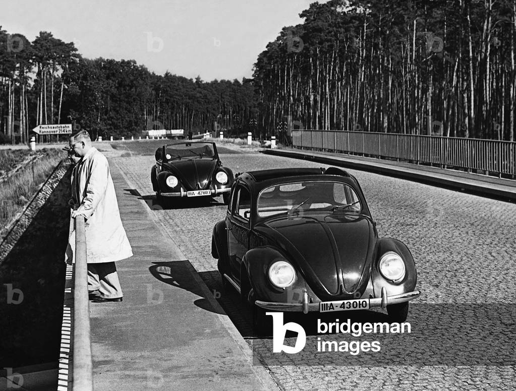 VW Beetle on a highway bridge, 1939 (b/w photo)