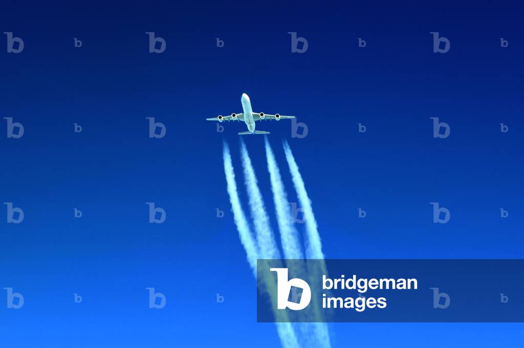 Condensation trails of a Air France Airbus A340 over the clouds, Germany, 2014 (photo)