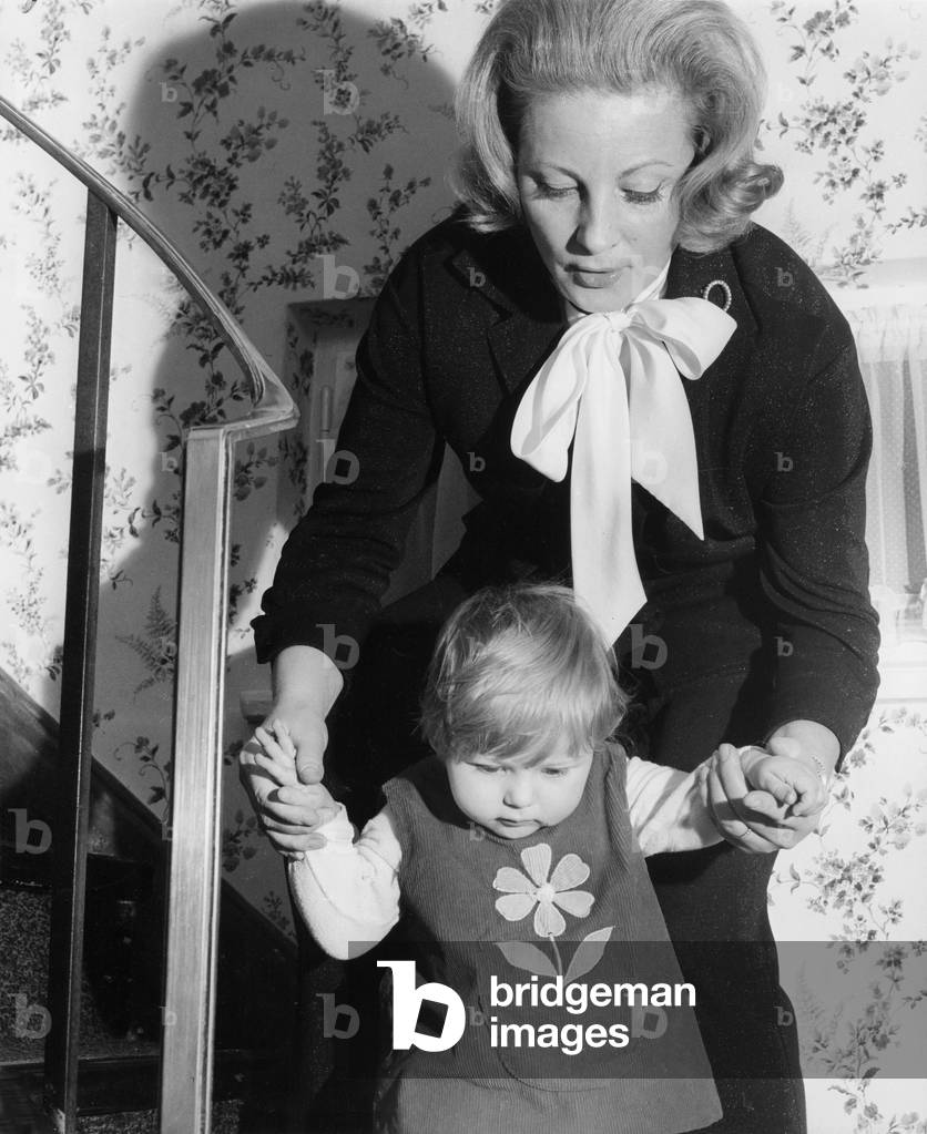 Mother with daughter, 1950s (b/w photo)