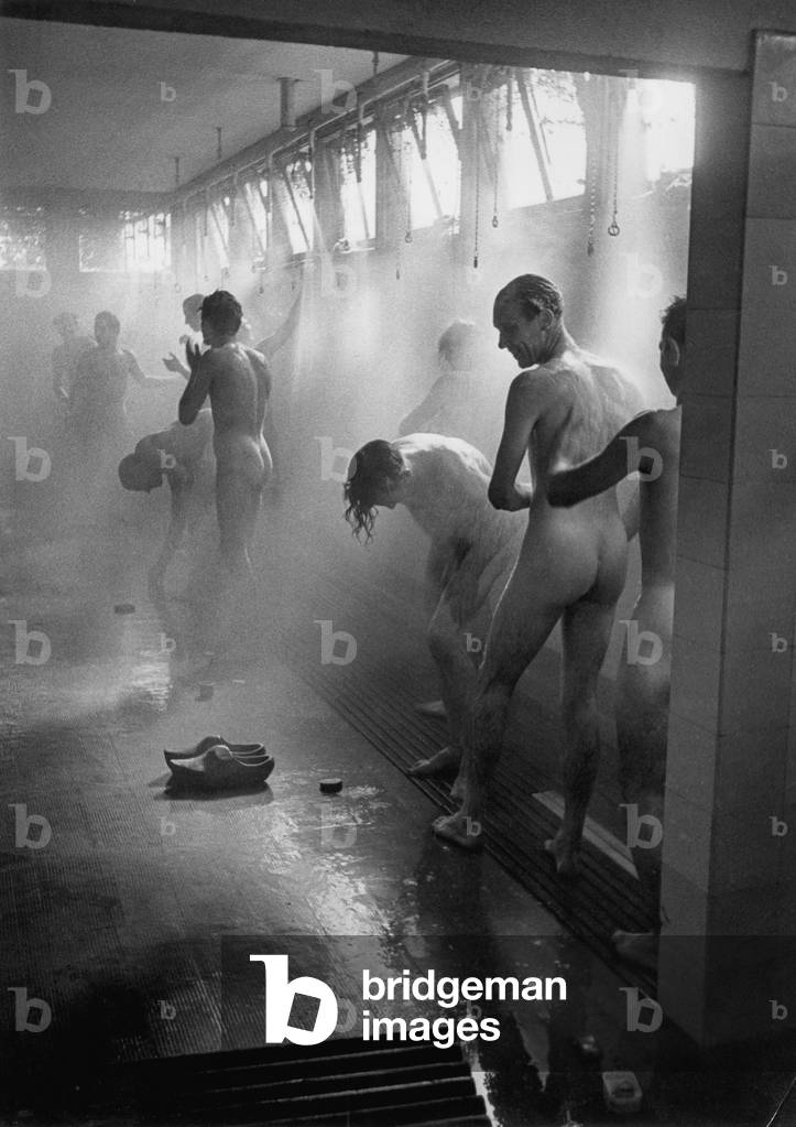 Forced laborers showering, 1943 (b/w photo)