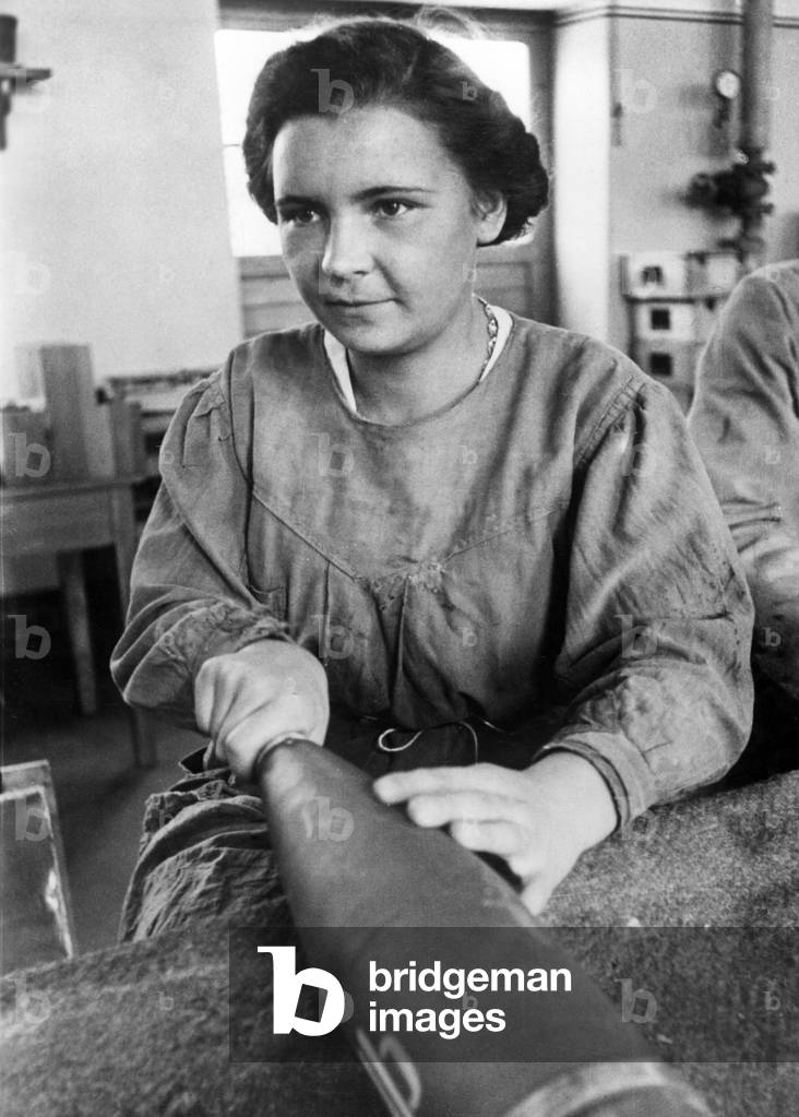 Women in the arms industry, munitions factory, 1939 (b/w photo)