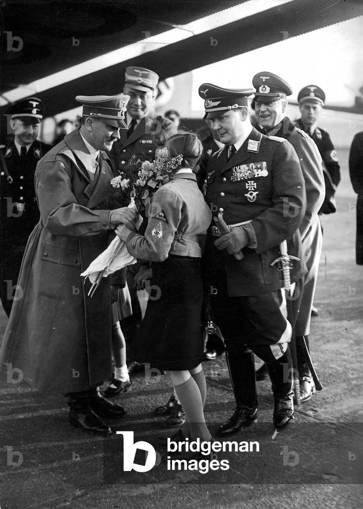 Hitler, Goering, Keitel, Dietrich und Brueckner greeted by a girl form the League of German Girls (BDM), 1938 (b/w photo)