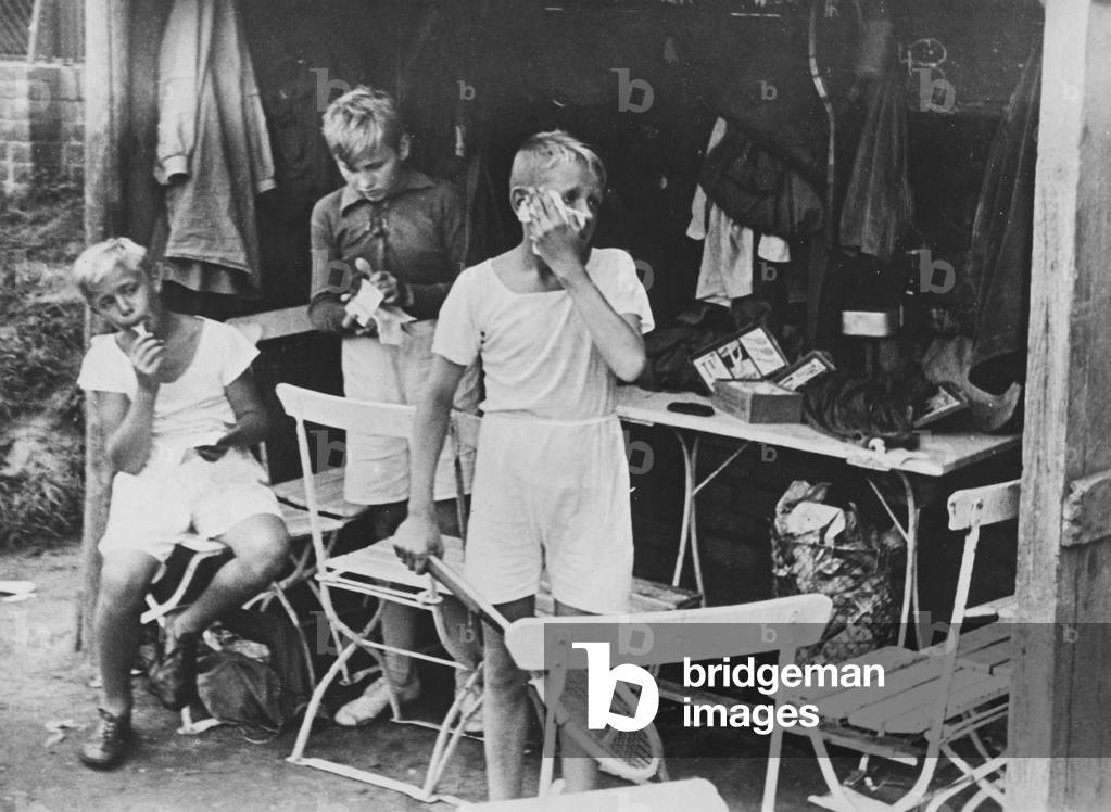 Tennis ball boy, 1930 (b/w photo)