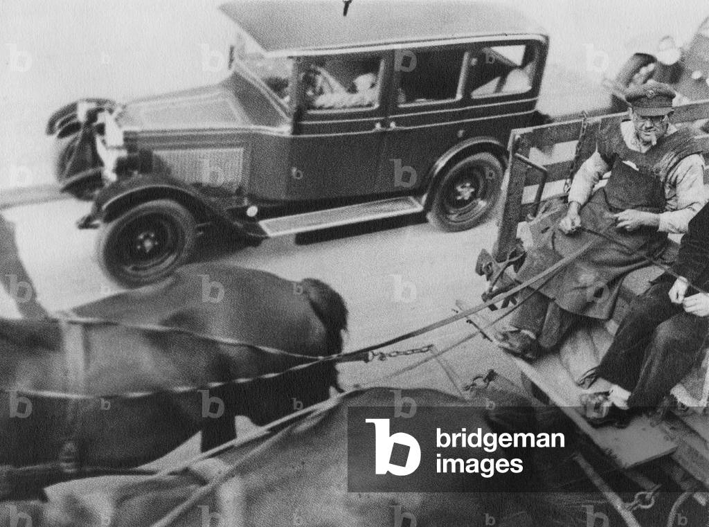 Horse carriage next to an automobile, 1930 (b/w photo)