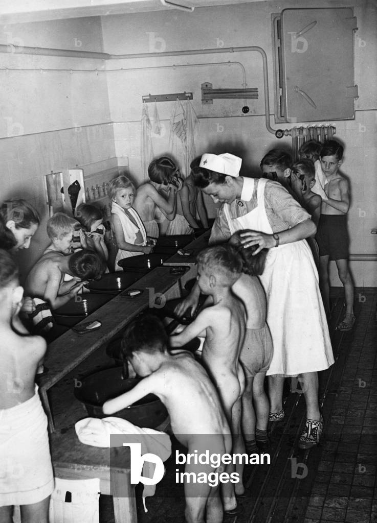 A group of children in an air-raid shelter, 1942 (b/w photo)