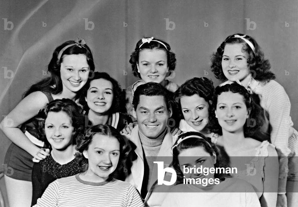 Johnny Weissmuller with dancers, 1932 (b/w photo)