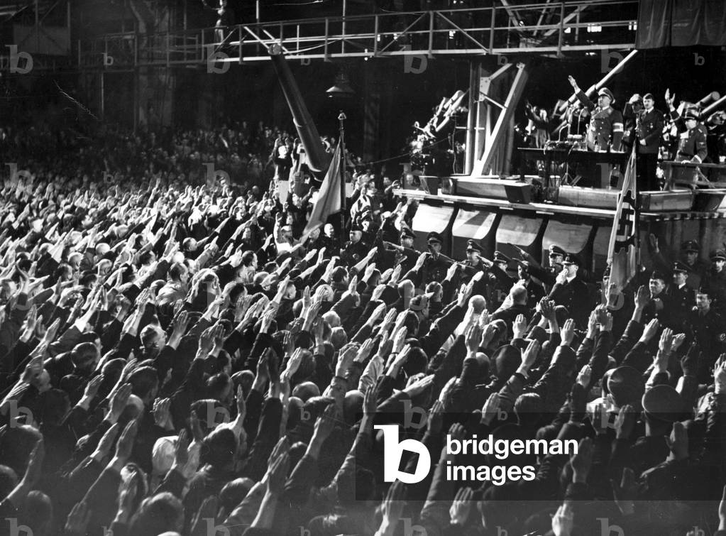 Adolf Hitler in a speech to defense workers, 1940 (b/w photo)