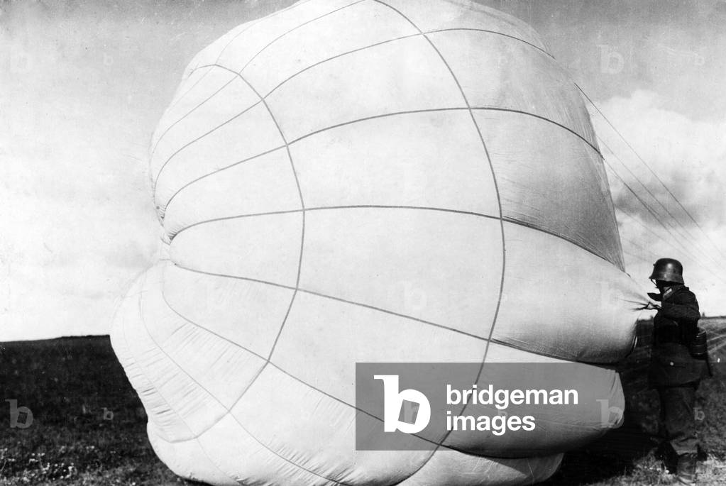 Soldiers rescue a parachute, 1918 (b/w photo)