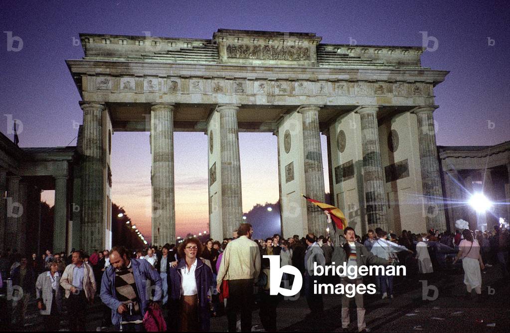 Celebrating the reunification at the Brandenburg Gate, 1990