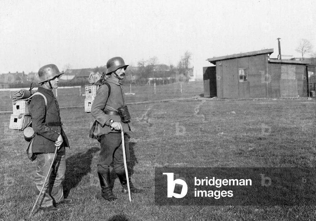 German soldiers carry pigeons to the front, 1918 (b/w photo)