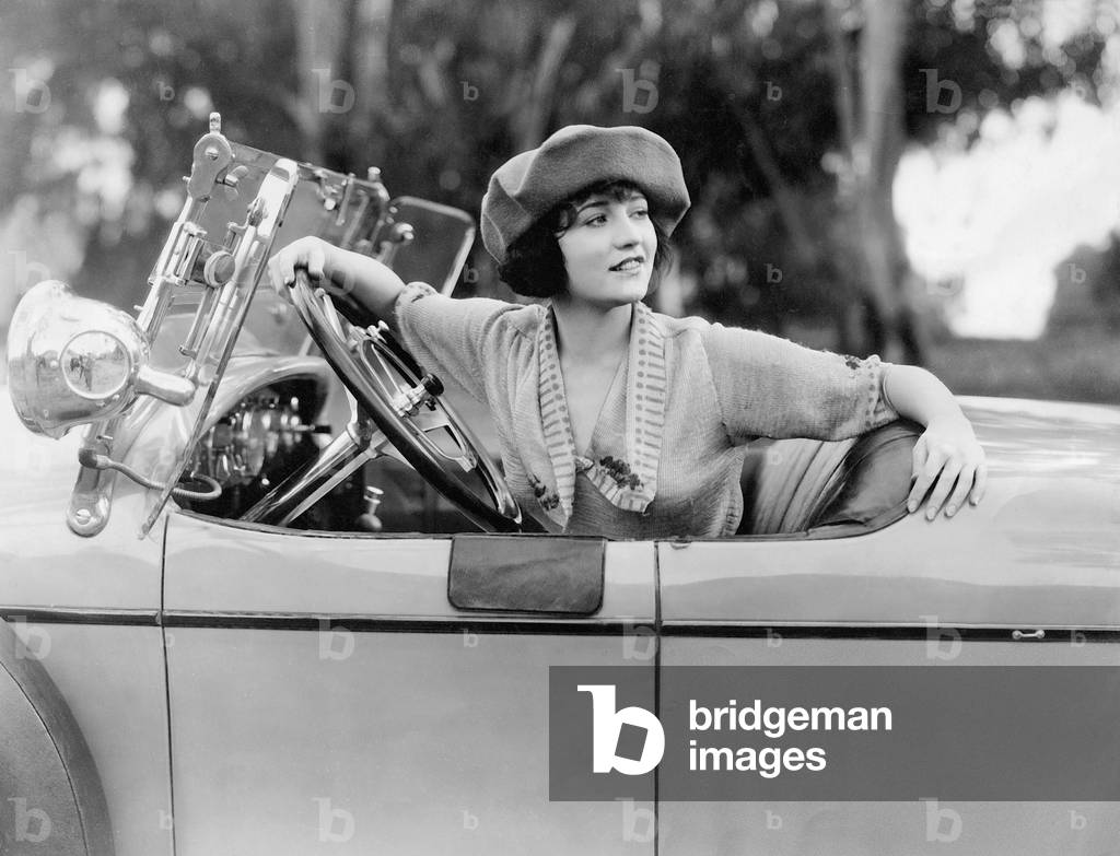 Betty Compson at the wheel of a car, 1921 (b/w photo)