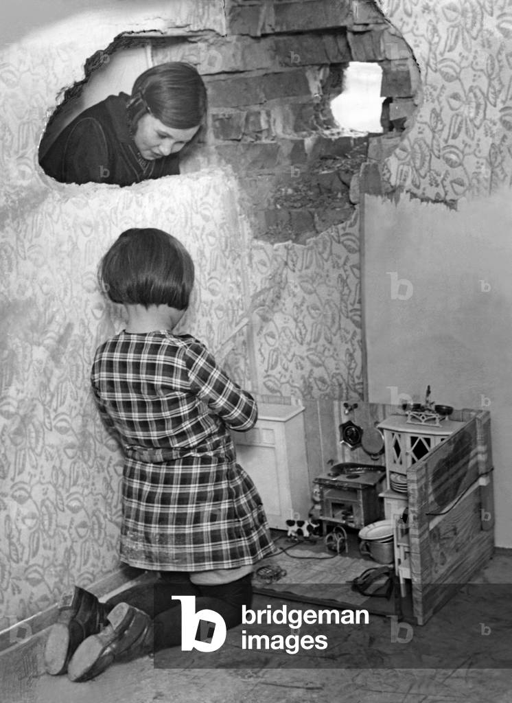 Girl with doll's house, 1934 (b/w photo)