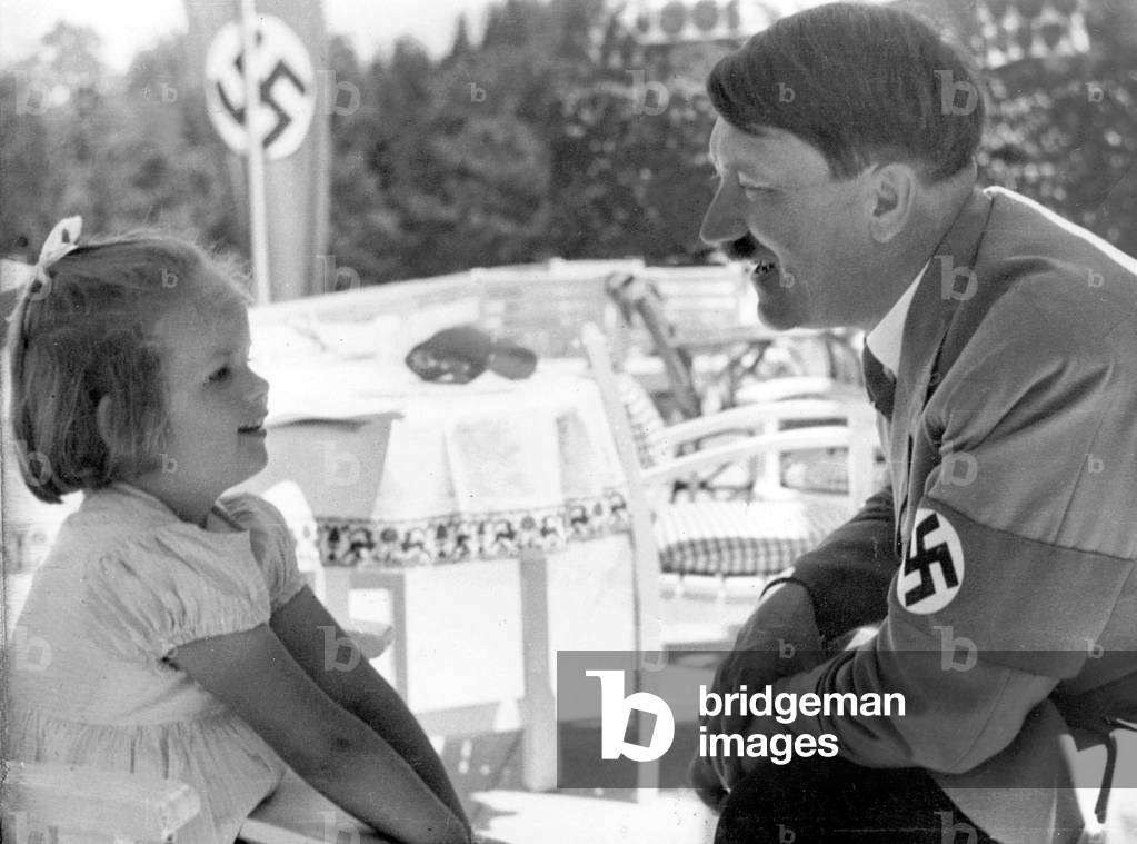 Adolf Hitler with a child on the Obersalzberg (b/w photo)