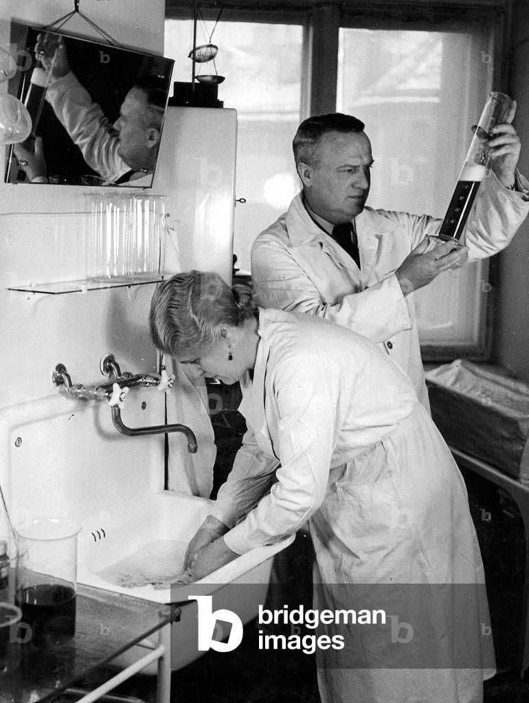 Chemist in a lab, 1940 (b/w photo)