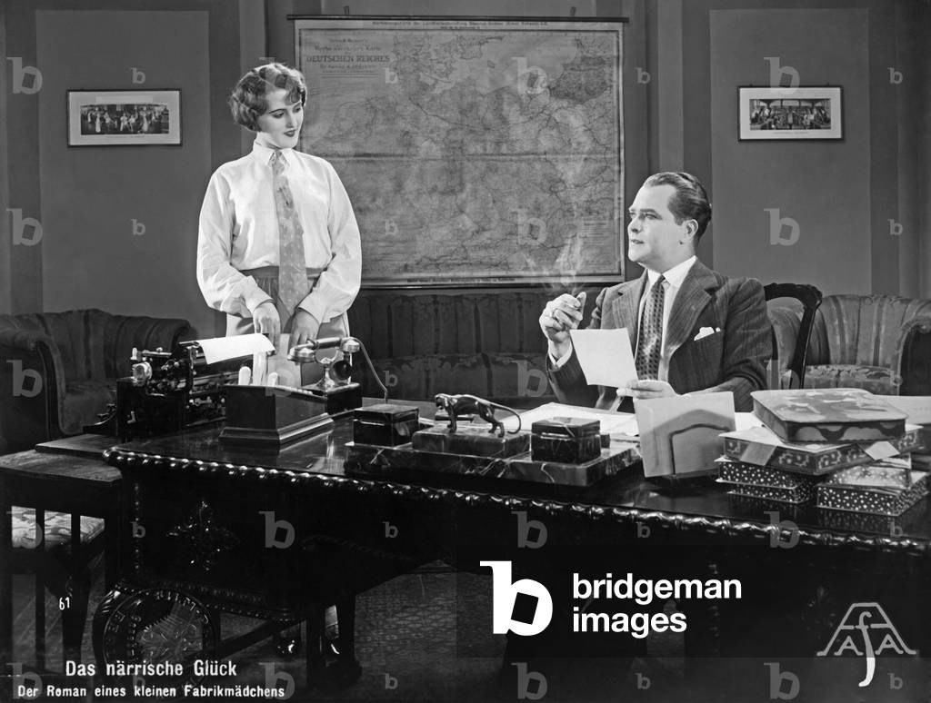 Office worker at the boss, 1929 (b/w photo)