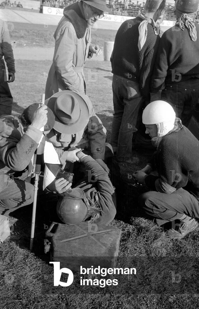 An injured driver of the stock car race, 1954 (b/w photo)