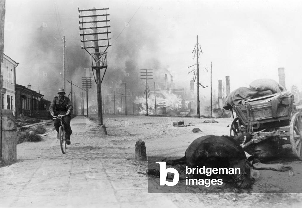 A soldier on a bike on the northern part of the Eastern Front, 1941 (b/w photo)