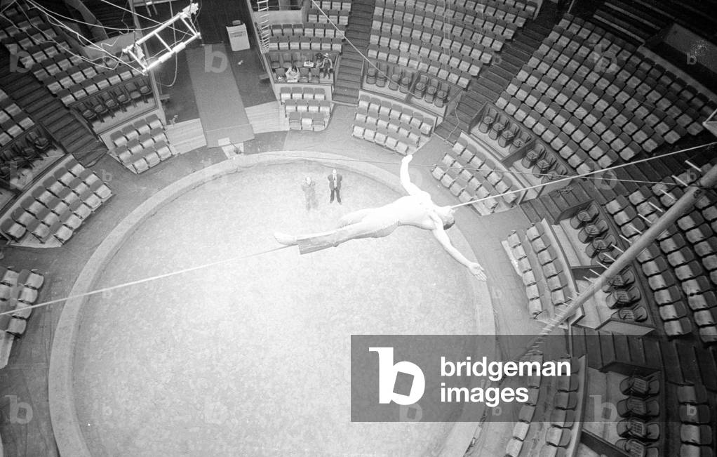 Tightrope artist in the circus, 1974 (b/w photo)