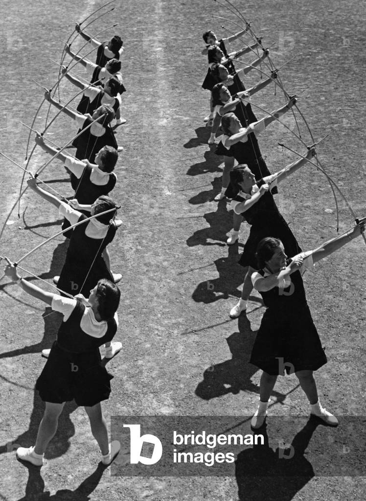 Young women practicing archery in Italy, 1930's (b/w photo)